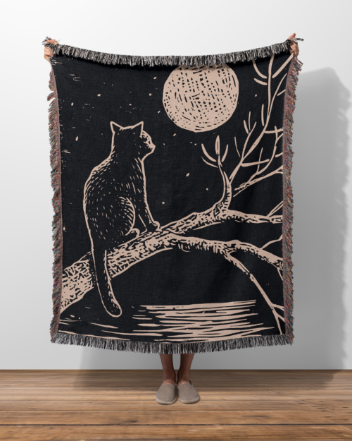 black cat in the moonlight woven blanket